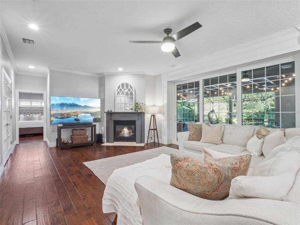 2509 Ridgewind Way Windermere, FL 34786 - Photo 5 of 39 a living room with furniture and a fireplace