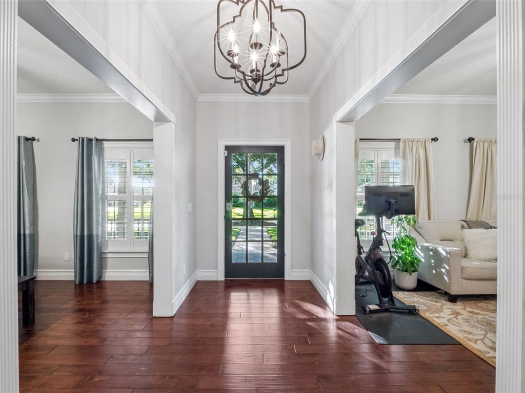 2509 Ridgewind Way Windermere, FL 34786 - Photo 6 of 39 a view of livingroom with furniture wooden floor and windows