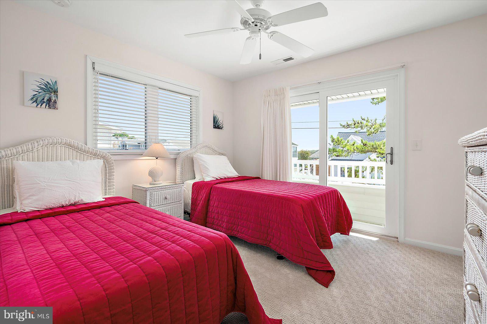 409 Bristol Road South Bethany, DE 19930 - Photo 50 of 89 a spacious bedroom with two beds and a large window