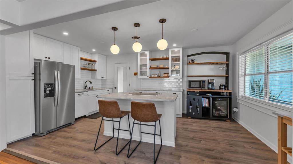 835 Chatfield Street Lakeland, FL 33803 - Photo 11 of 54 a kitchen with stainless steel appliances a refrigerator sink and stove