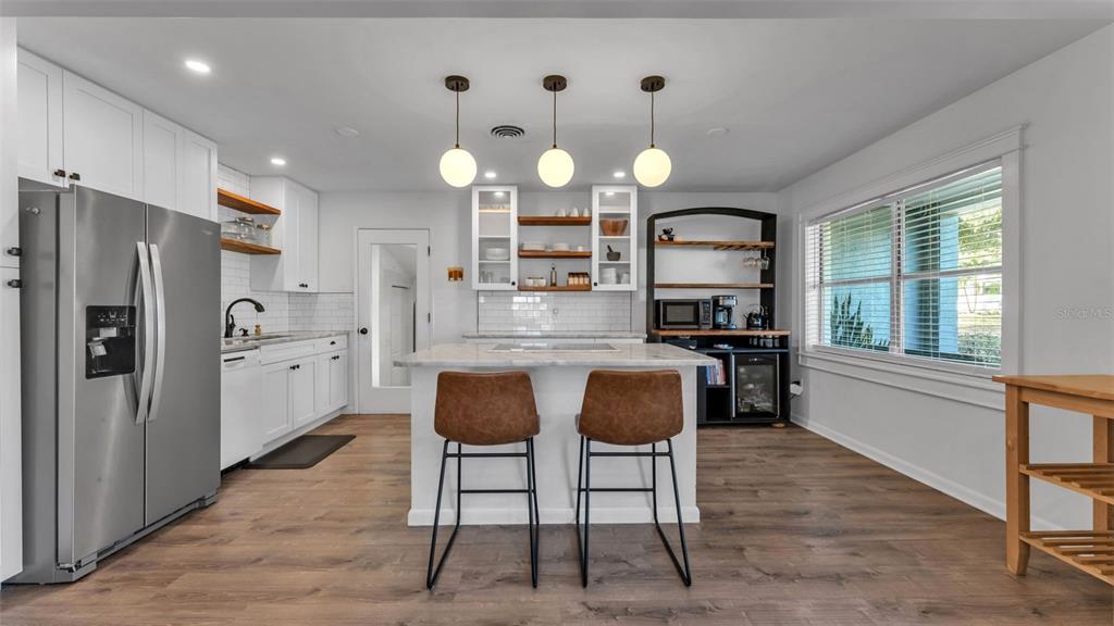 835 Chatfield Street Lakeland, FL 33803 - Photo 13 of 54 a large kitchen with a table and chairs