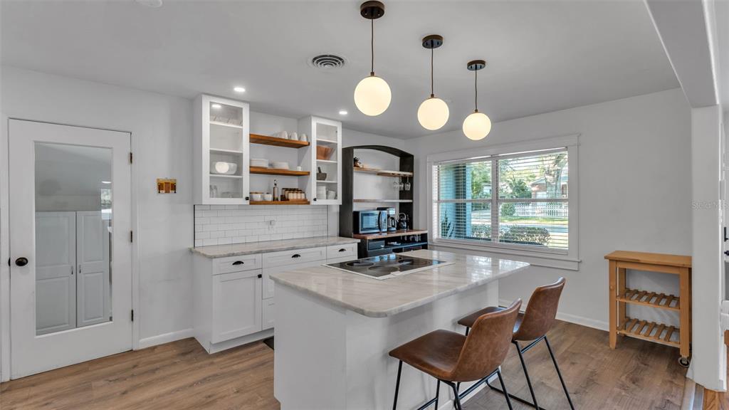835 Chatfield Street Lakeland, FL 33803 - Photo 14 of 54 a view of a kitchen and dining room