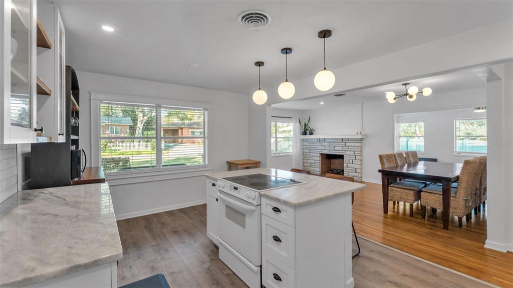 835 Chatfield Street Lakeland, FL 33803 - Photo 17 of 54 a kitchen with a stove and a wooden floor