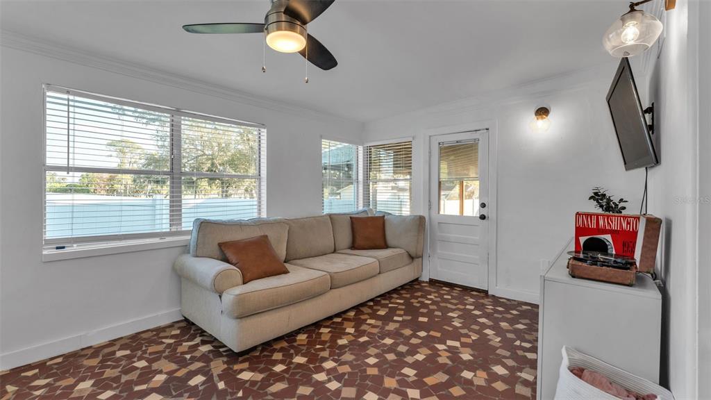 835 Chatfield Street Lakeland, FL 33803 - Photo 20 of 54 a living room with furniture and a flat screen tv