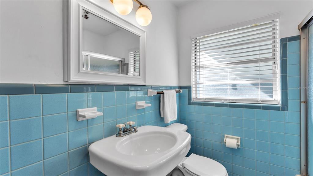 835 Chatfield Street Lakeland, FL 33803 - Photo 28 of 54 a bathroom with a toilet sink and mirror