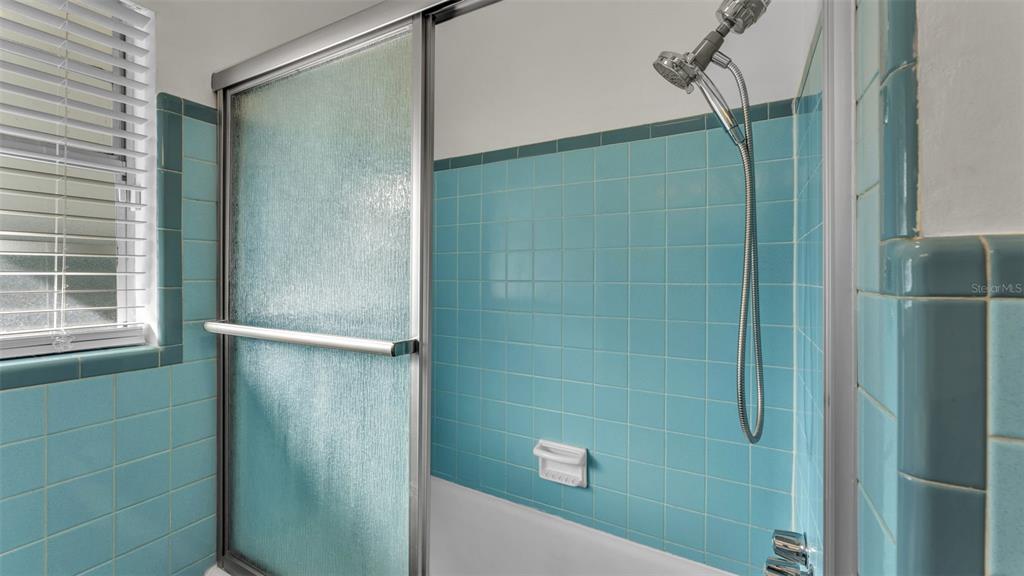 835 Chatfield Street Lakeland, FL 33803 - Photo 29 of 54 a bathroom with a shower and a sink