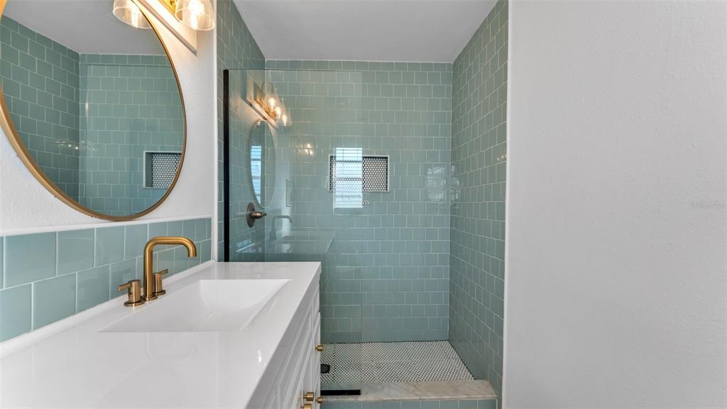 835 Chatfield Street Lakeland, FL 33803 - Photo 34 of 54 a bathroom with a sink and a mirror