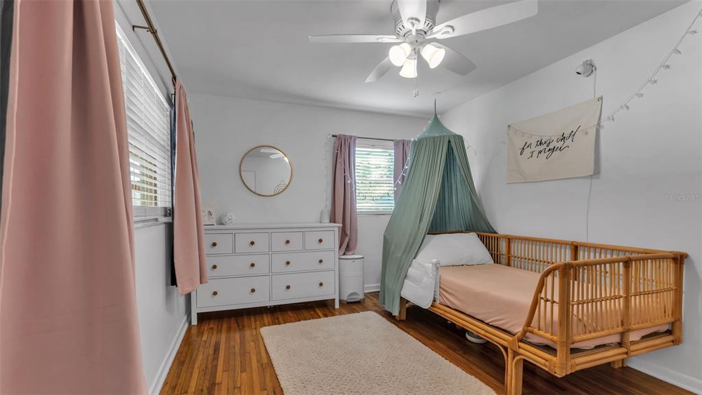 835 Chatfield Street Lakeland, FL 33803 - Photo 37 of 54 a bedroom with a bed and a dresser