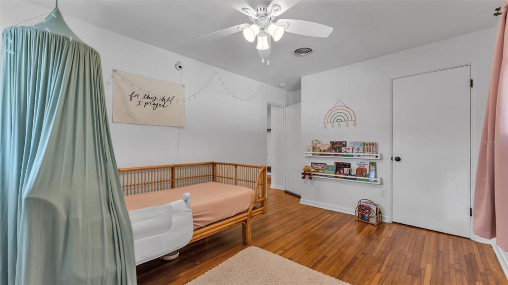 835 Chatfield Street Lakeland, FL 33803 - Photo 38 of 54 a hallway with furniture and wooden floor