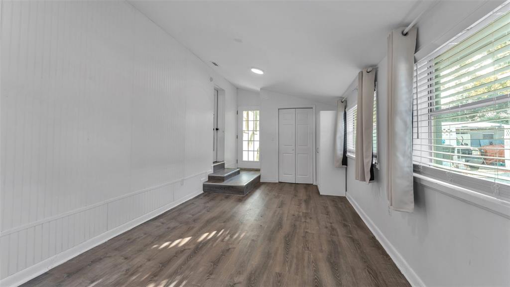 835 Chatfield Street Lakeland, FL 33803 - Photo 40 of 54 a view of a big room with wooden floor and windows