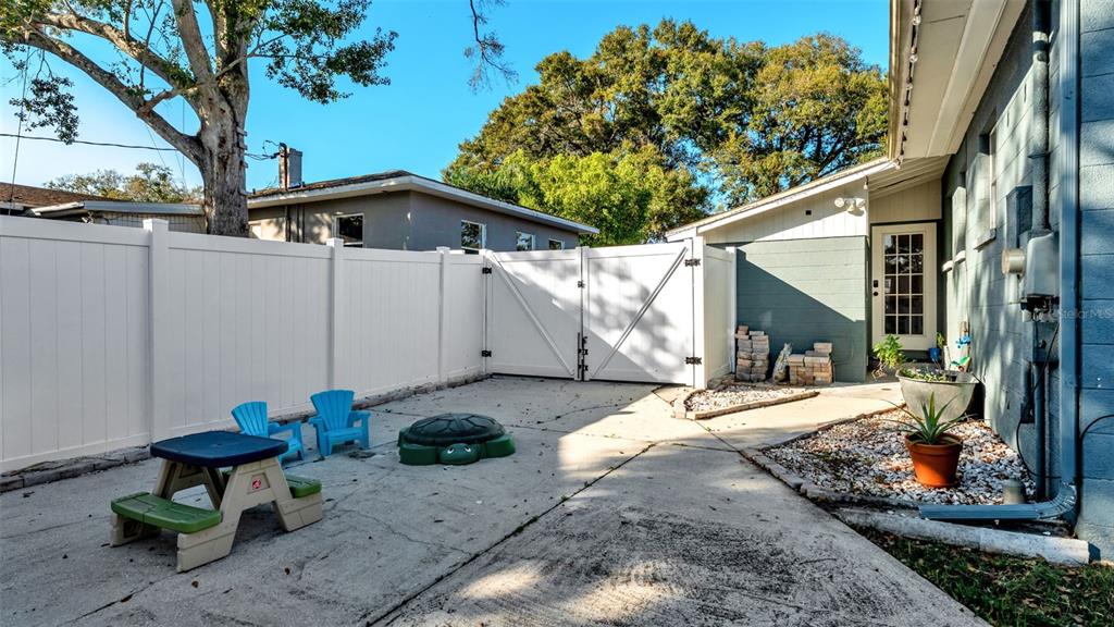 835 Chatfield Street Lakeland, FL 33803 - Photo 47 of 54 a view of a house with backyard and sitting area
