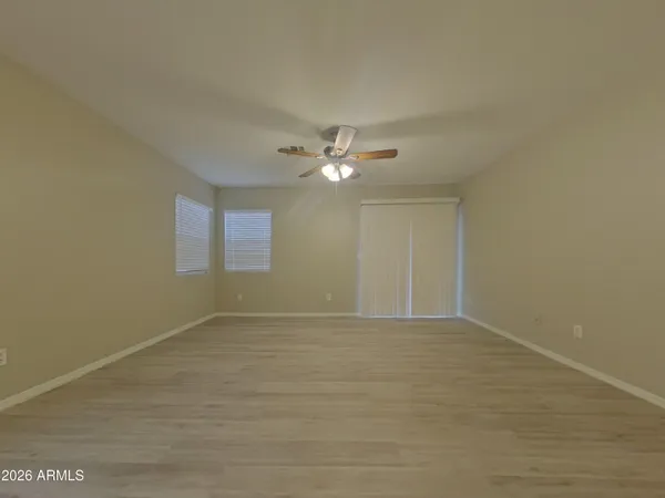 a view of an empty room and a window