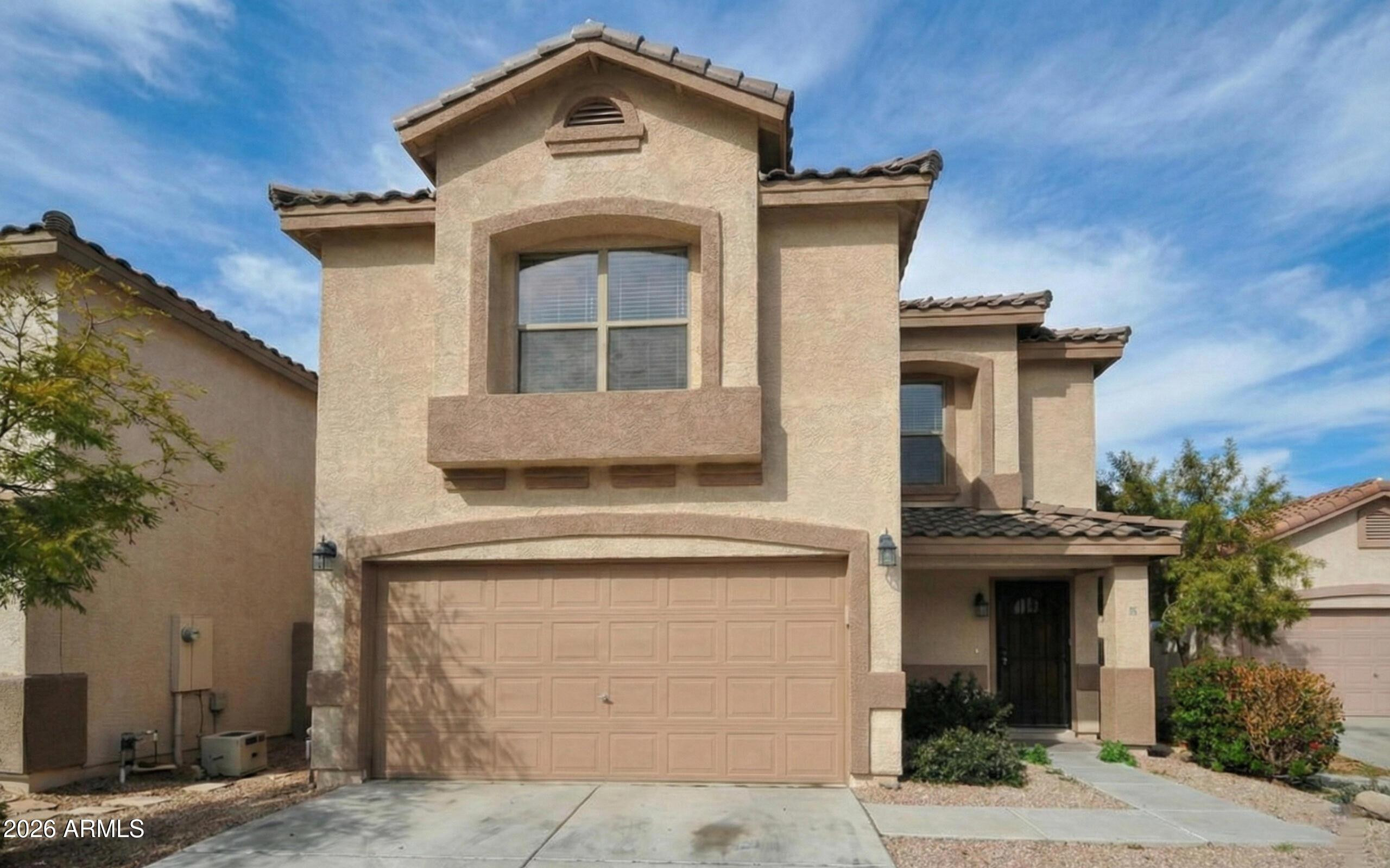 3331 South Chaparral Road Apache Junction, AZ 85119 - Photo 1 of 24 a front view of a house with a yard