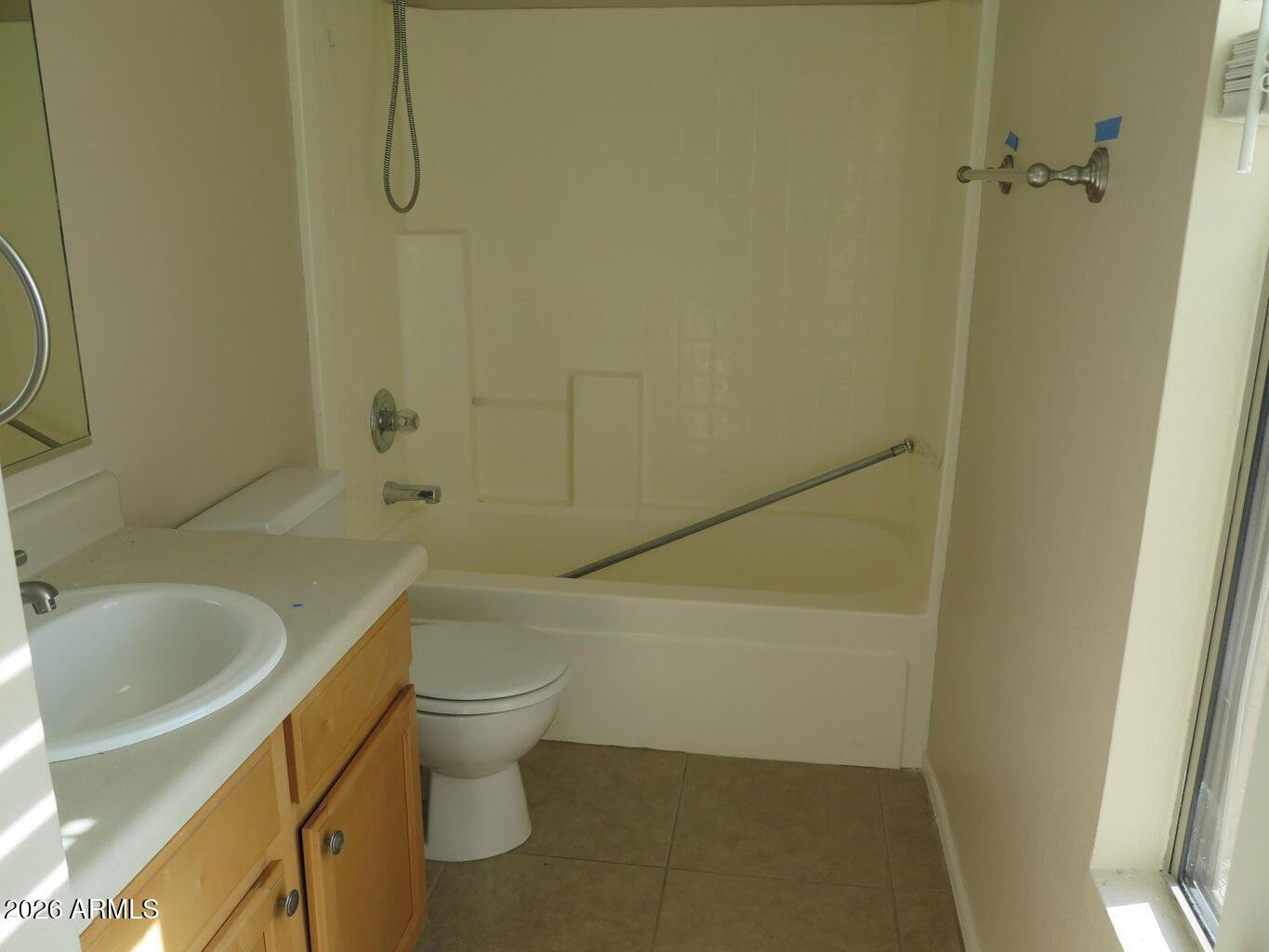 3331 South Chaparral Road Apache Junction, AZ 85119 - Photo 16 of 24 a bathroom with a toilet and a sink