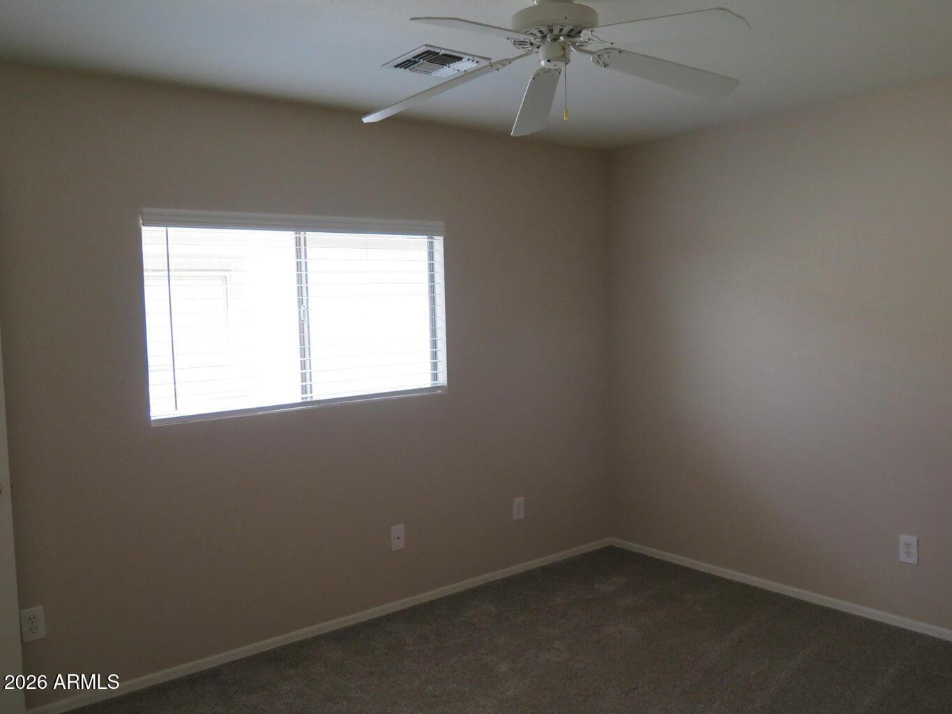 3331 South Chaparral Road Apache Junction, AZ 85119 - Photo 18 of 24 an empty room with a window