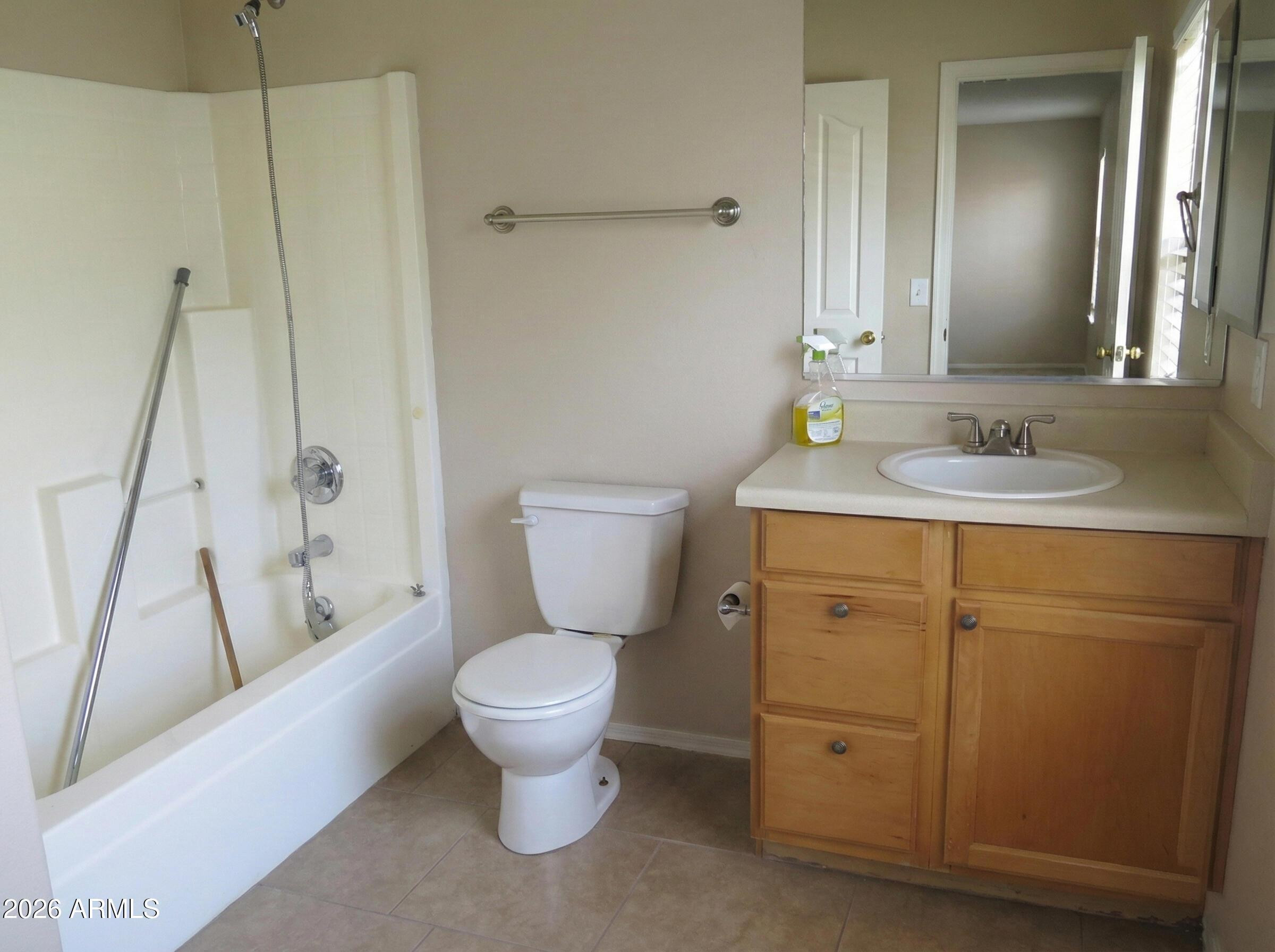 3331 South Chaparral Road Apache Junction, AZ 85119 - Photo 19 of 24 a bathroom with a toilet sink and a mirror