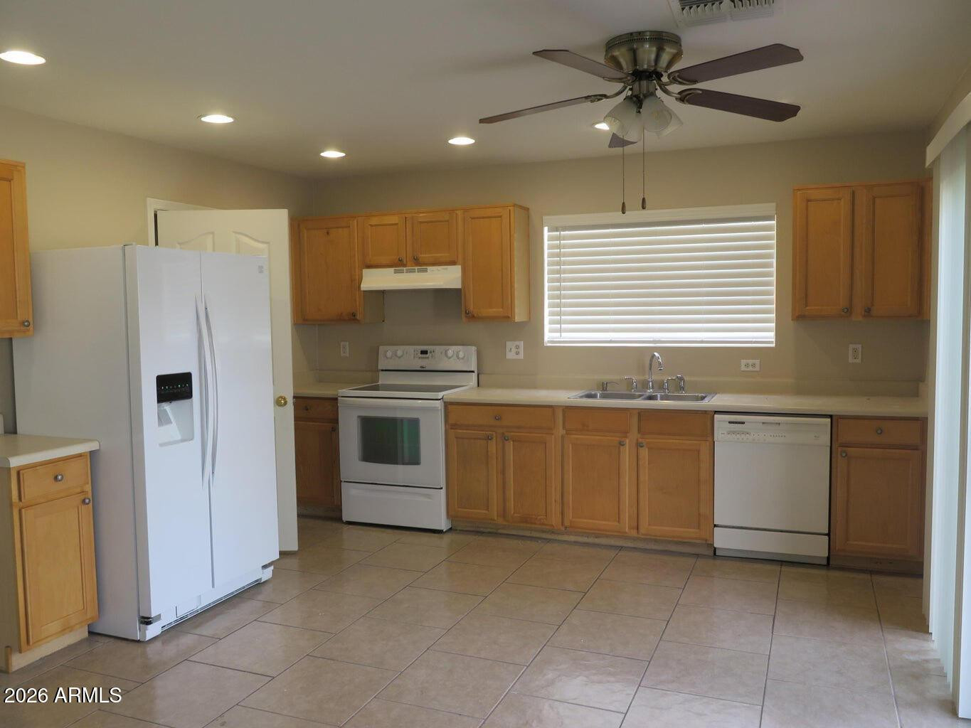 3331 South Chaparral Road Apache Junction, AZ 85119 - Photo 5 of 24 a kitchen with a refrigerator a sink and dishwasher