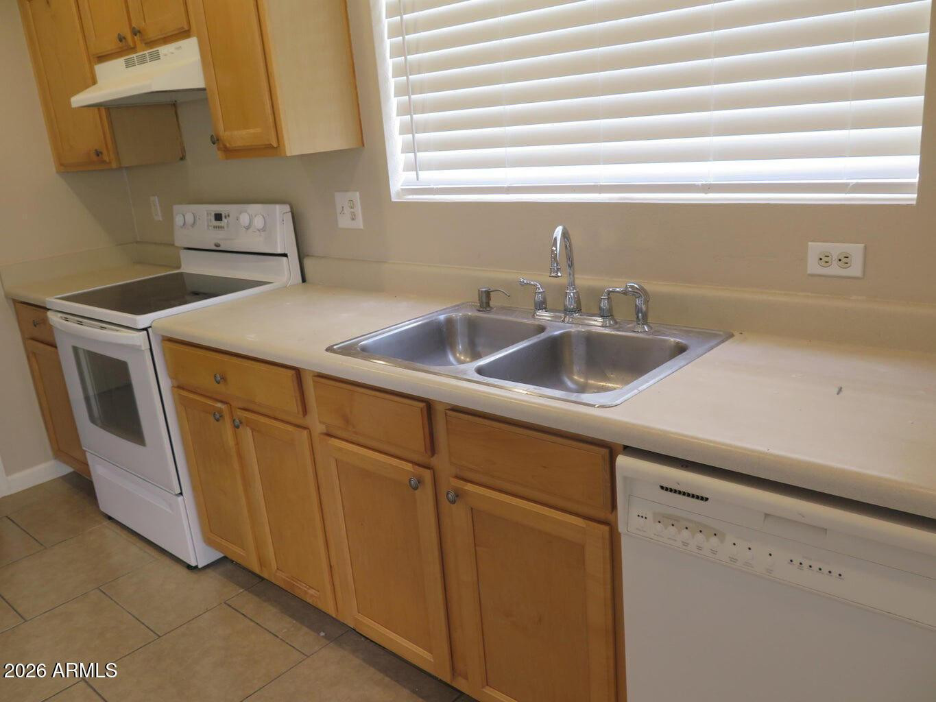 3331 South Chaparral Road Apache Junction, AZ 85119 - Photo 7 of 24 a kitchen with a sink and cabinets
