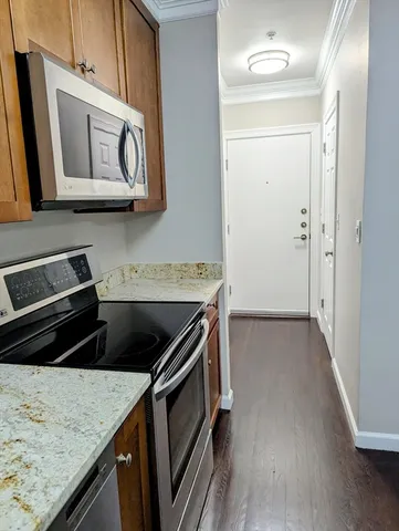 a bedroom with furniture and a wooden floor