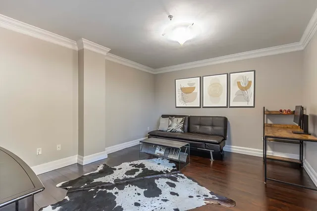 a kitchen with a sink a microwave and cabinets