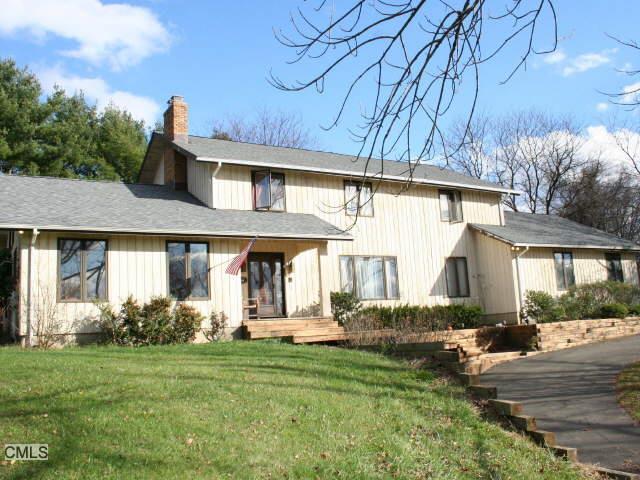 266 Ridgebury Road Ridgefield, CT 06877 - Photo 1 of 1 a front view of a house with garden