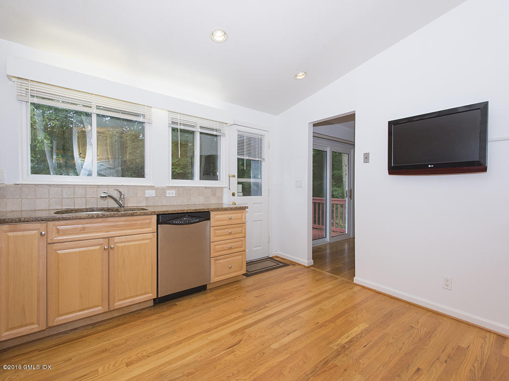 6 Crawford Terrace Riverside, CT 06878 - Photo 13 of 29 a kitchen with granite countertop a sink and a stove top oven
