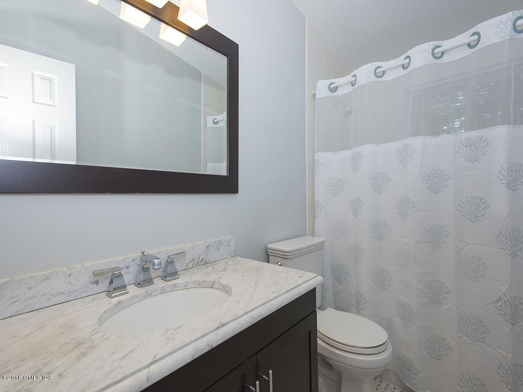 6 Crawford Terrace Riverside, CT 06878 - Photo 14 of 29 a bathroom with a granite countertop sink mirror and toilet