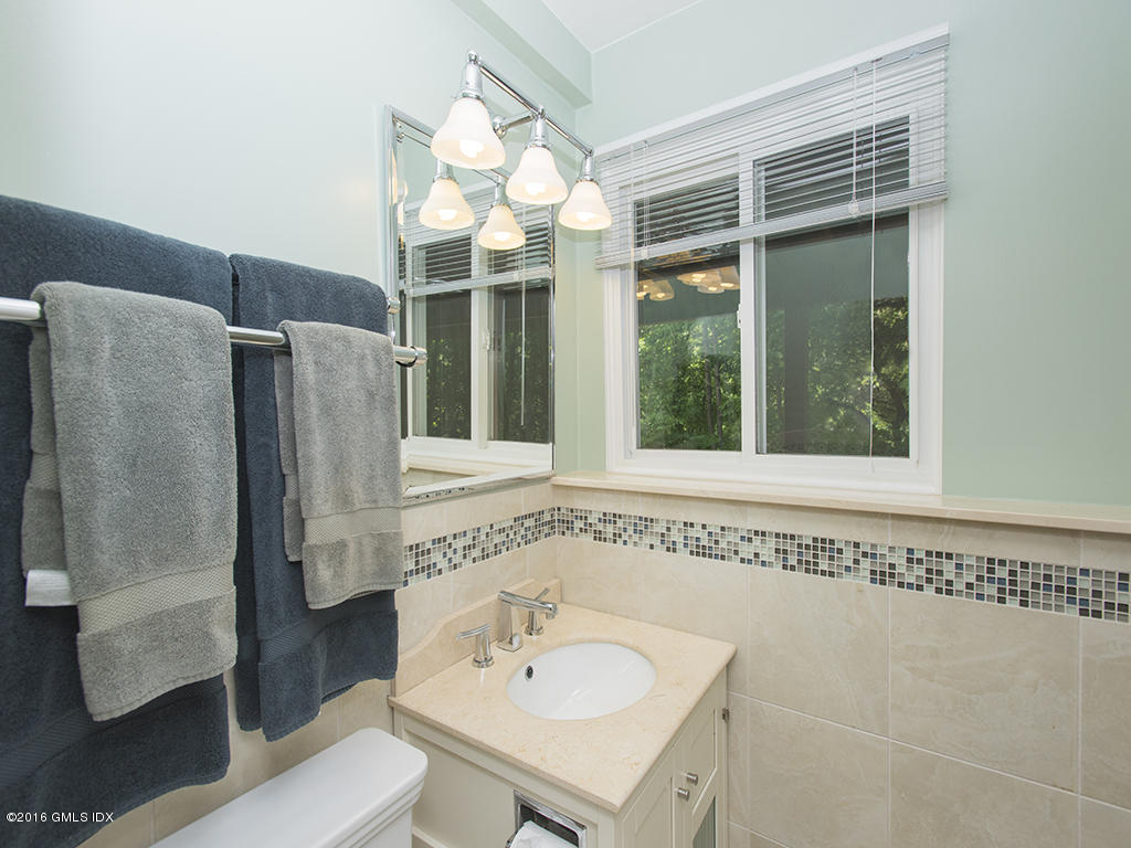 6 Crawford Terrace Riverside, CT 06878 - Photo 22 of 29 a bathroom with a sink and a mirror