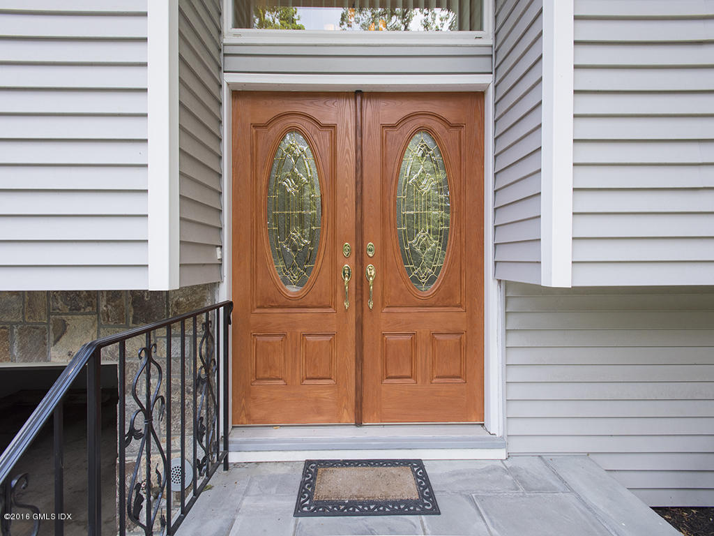 6 Crawford Terrace Riverside, CT 06878 - Photo 3 of 29 a front view of a house with garden