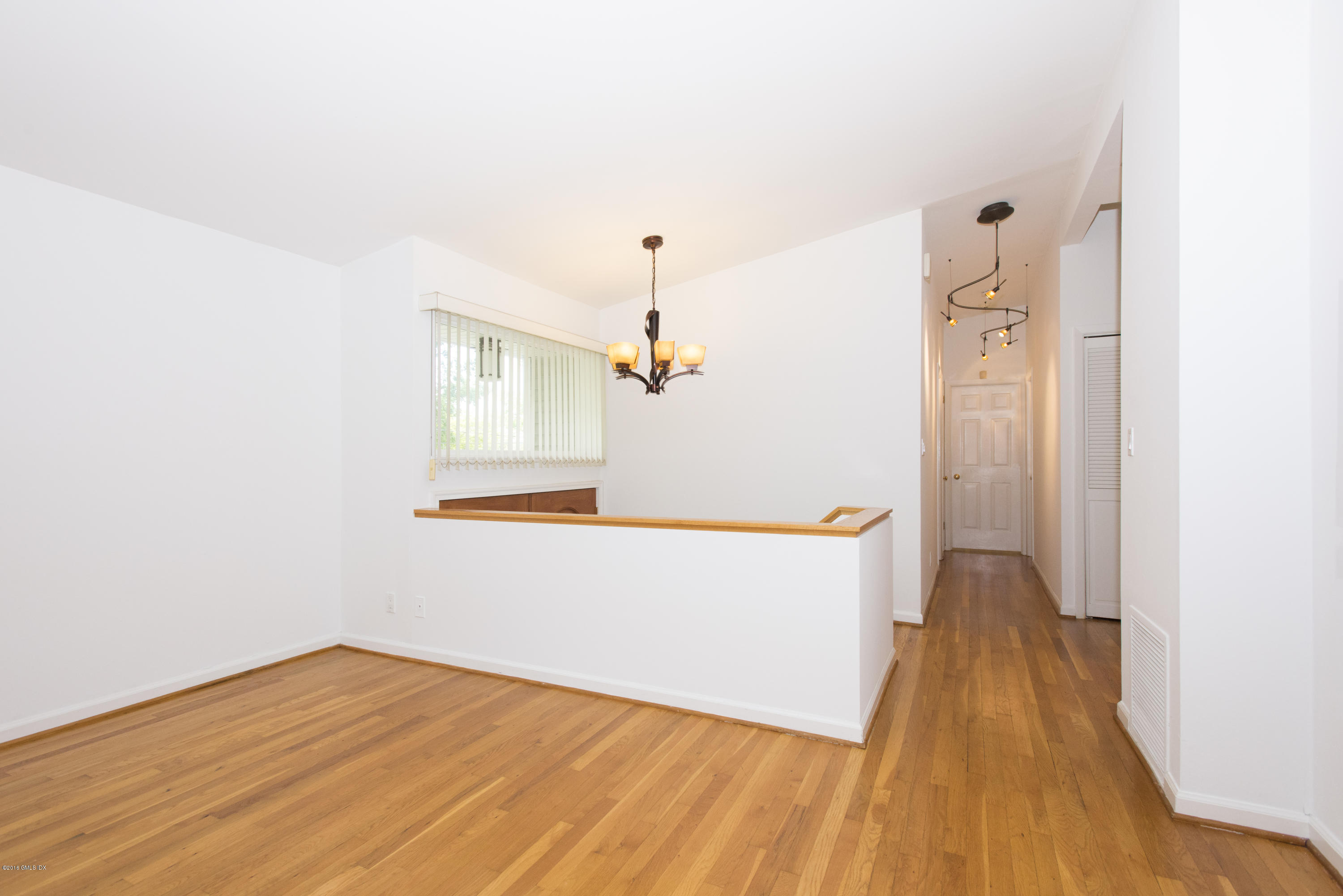 6 Crawford Terrace Riverside, CT 06878 - Photo 6 of 29 a view of a hallway with wooden floor and staircase