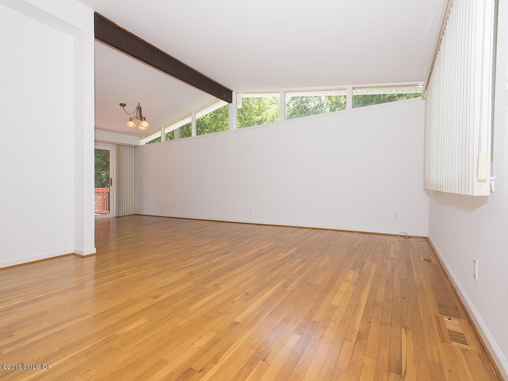 6 Crawford Terrace Riverside, CT 06878 - Photo 7 of 29 an empty room with wooden floor and windows
