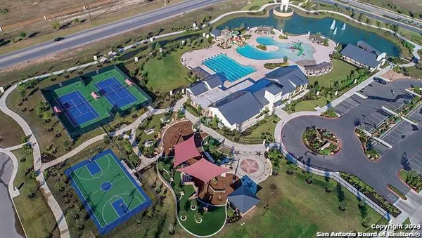 an aerial view of a house with outdoor space