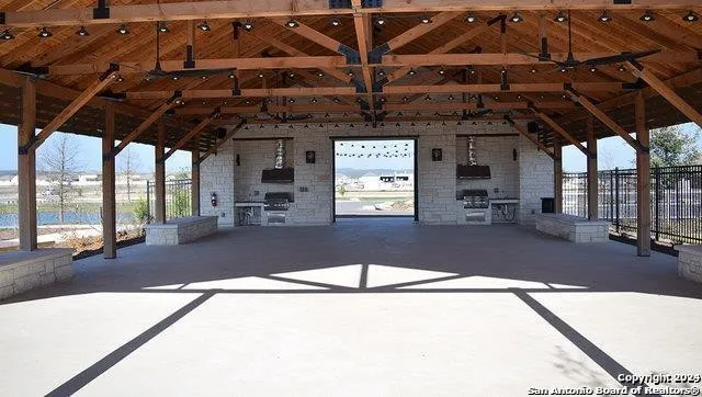 a view of a lake with large trees