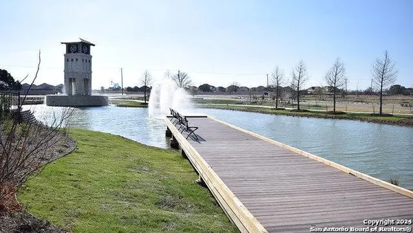 a balcony with chairs and a table