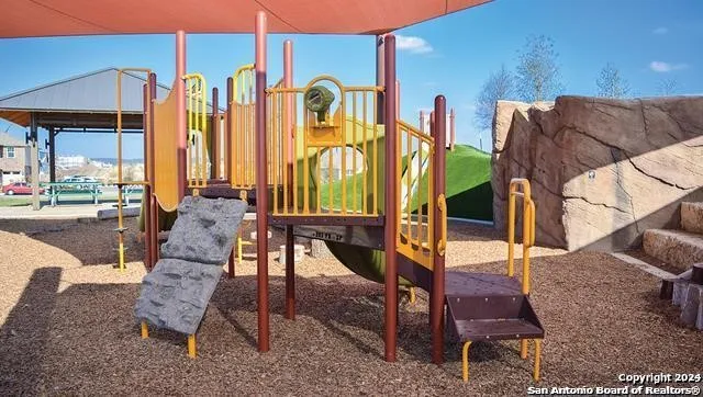 a view of a swimming pool with sitting area