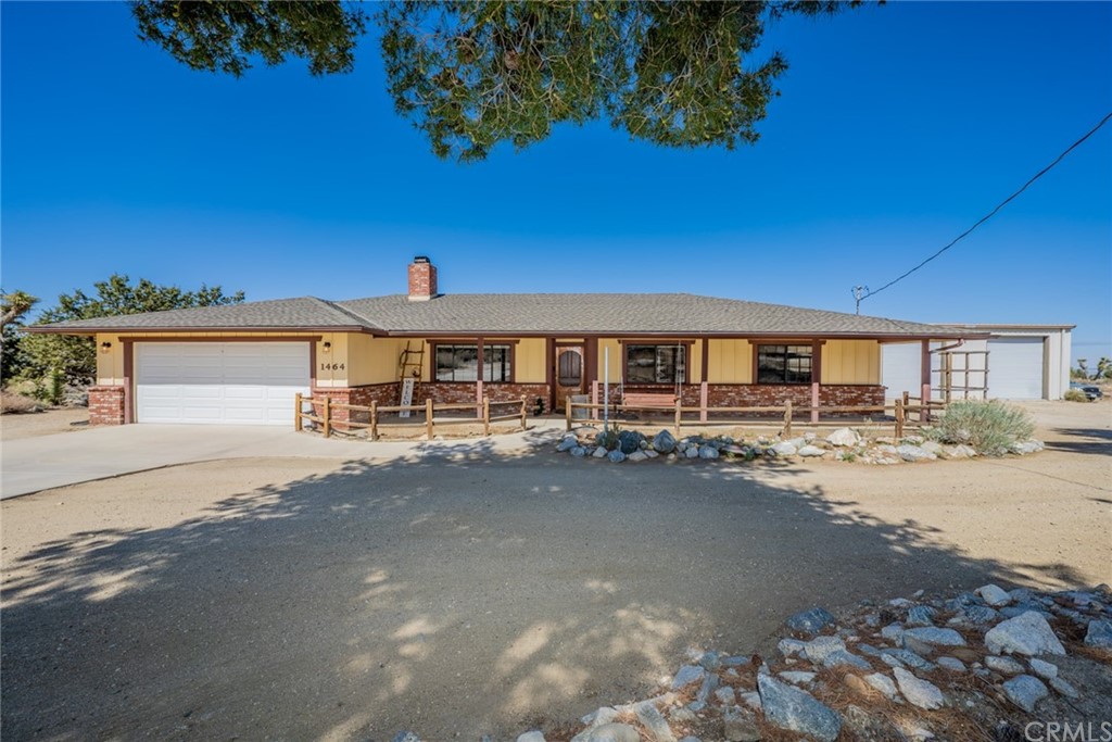 1464 Smoke Tree Road Pinon Hills, CA 92372 - Photo 1 of 1 a couple of cars parked in front of a house