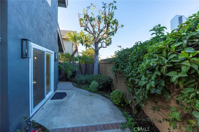 a view of a kitchen with a refrigerator and a large window