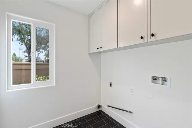 a bathroom with a double vanity sink a toilet and shower