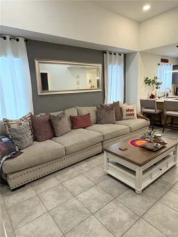 a living room with furniture and a rug