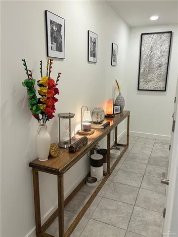 a living room with furniture and flowers