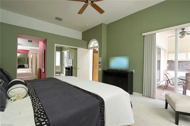 a bedroom with a bed and a chair