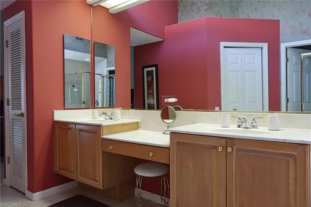 a bathroom with a sink vanity and a mirror