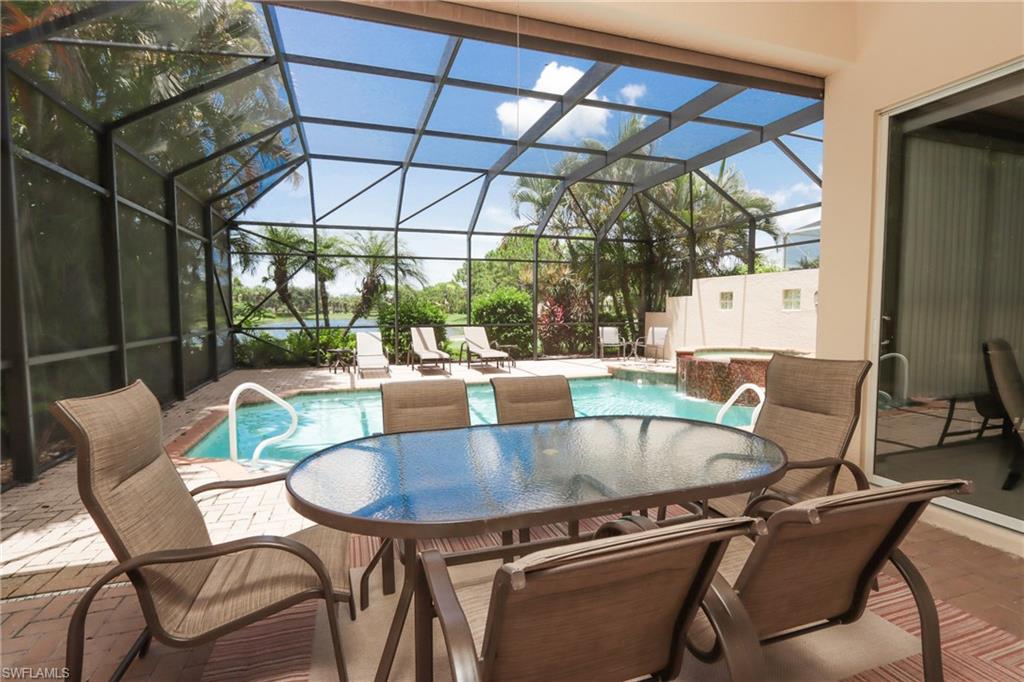 5901 Ashford Lane Naples, FL 34110 - Photo 25 of 30 a view of a chairs and table in the patio
