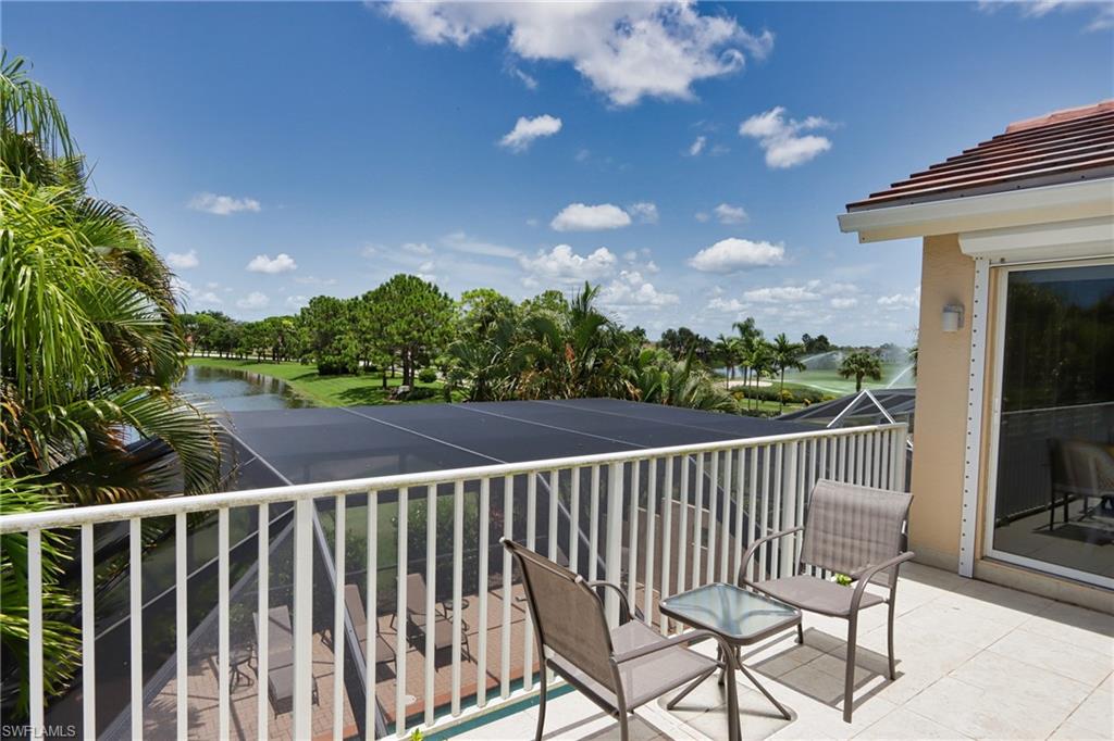 5901 Ashford Lane Naples, FL 34110 - Photo 26 of 30 a view of balcony with wooden floor and outdoor seating