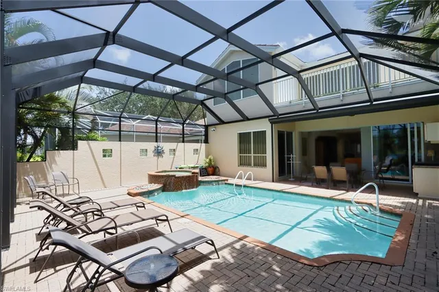 a view of a patio with table and chairs with wooden floor