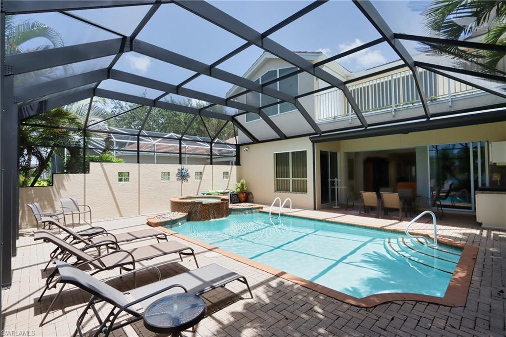 5901 Ashford Lane Naples, FL 34110 - Photo 30 of 30 a view of a patio with table and chairs with wooden floor