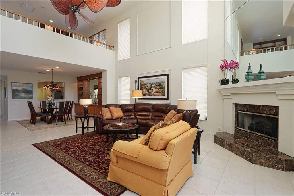 5901 Ashford Lane Naples, FL 34110 - Photo 3 of 30 a living room with furniture and a fireplace