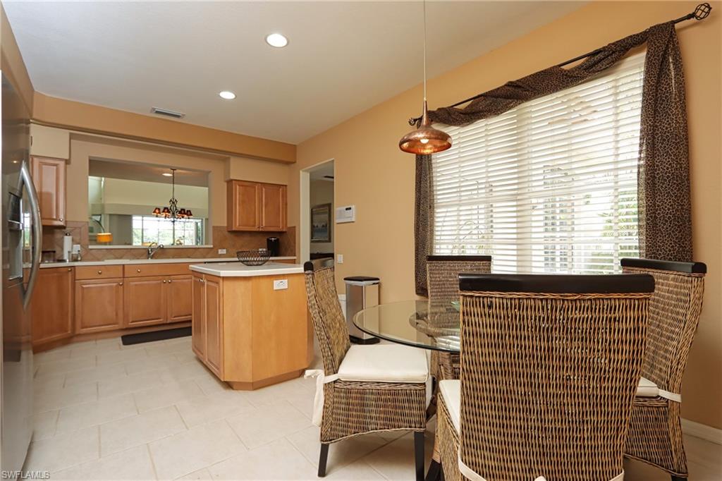 5901 Ashford Lane Naples, FL 34110 - Photo 7 of 30 a living room with a couch and a table
