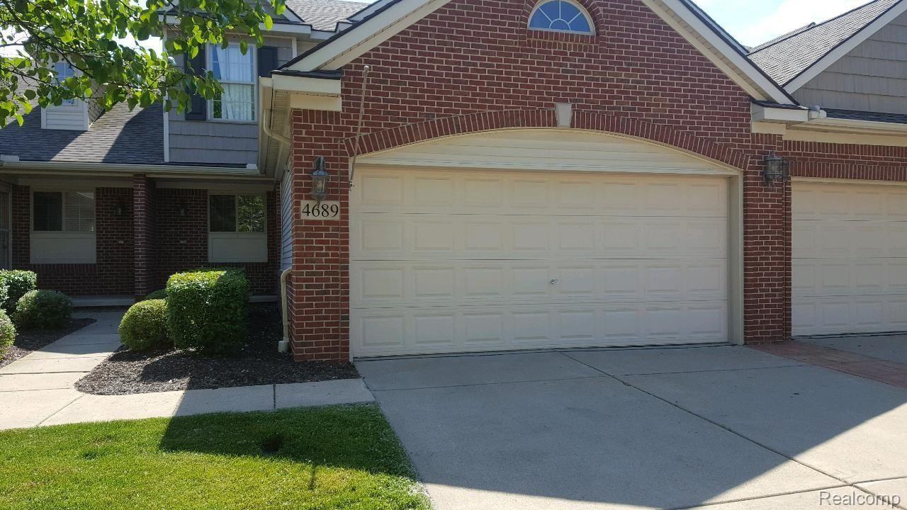 4689 Summer Ridge Drive, Unit 22 Howell, MI 48843 - Photo 1 of 9 22SP FRONT OUTSIDE.jpg