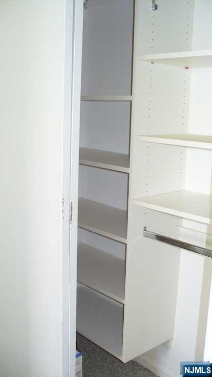 501 Linwood Drive, Unit 5J Fort Lee, NJ 07024 - Photo 12 of 23 a view of walk in closet with empty racks